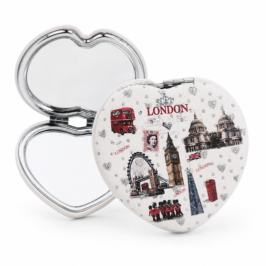 Heart-shaped compact mirror with London-themed design on a white background