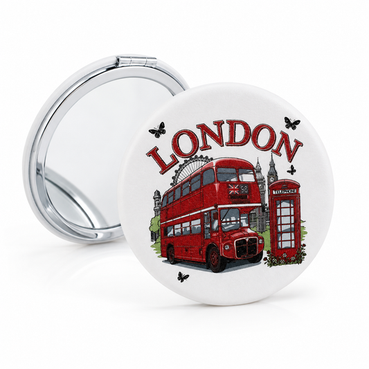 Compact mirror with London-themed design featuring a red double-decker bus and phone booth on a white background.