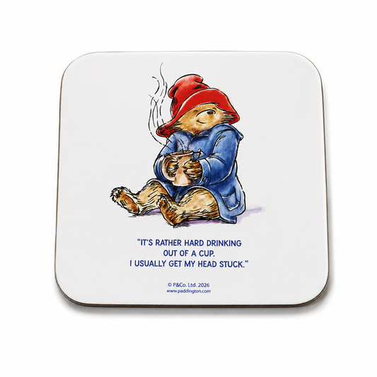 Official Paddington Bear ceramic coaster featuring a classic illustration of Paddington holding a steaming mug on a clean white background.