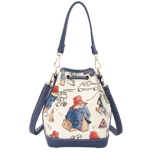 bag-front-view.jpg
Front view of a cream Paddington Bear print bucket bag with navy trim, drawstring closure and shoulder straps.