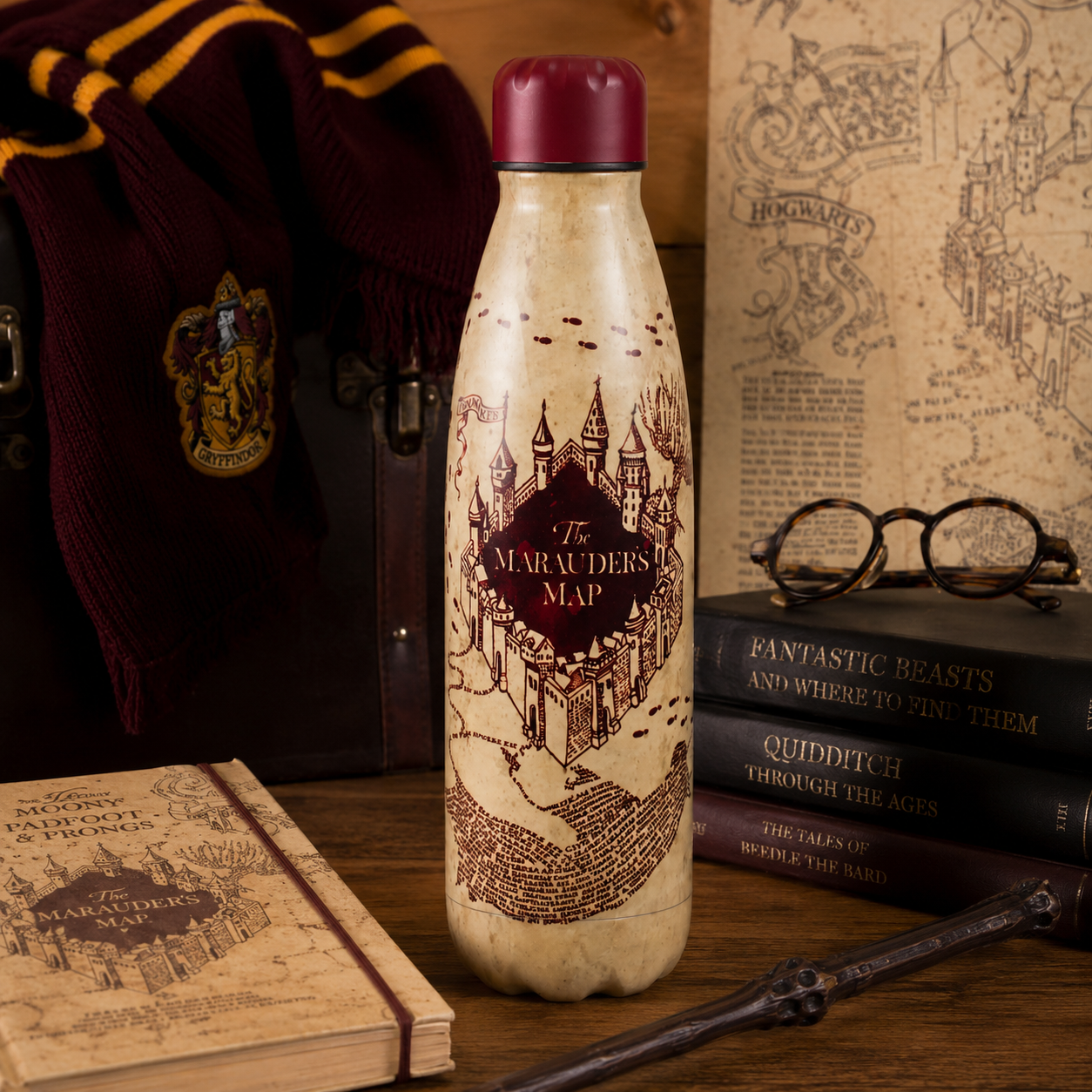 Water bottle with 'Marauder's Map' design in a Harry Potter theme, surrounded by books and glasses.