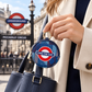 Piccadilly Line Mind the Gap coin purse attached to a handbag in London