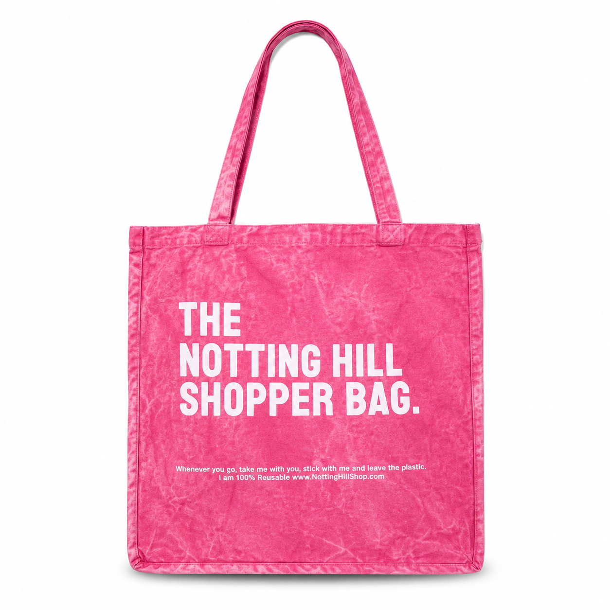 Pink tote bag with 'The Notting Hill Shopper Bag' text on a white background