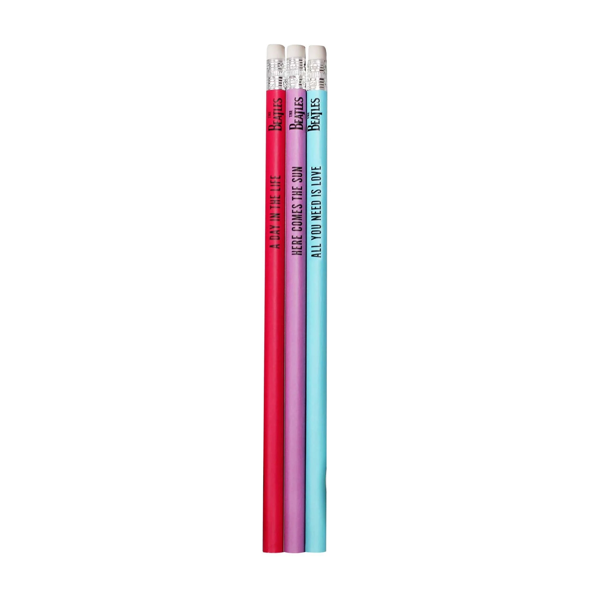Three pencils with colorful barrels on a white background