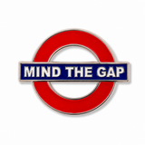 Mind the Gap metal enamel fridge magnet with London landmarks in the background