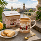 London souvenir mug with pink and gold decoration displayed outdoors in a travel-inspired setting