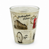 London souvenir shot glass with Big Ben, red bus, taxi and Tower Bridge design on white background