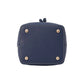 Bottom view of the Paddington Bear bucket bag showing the navy base, contrast stitching and four protective metal feet.