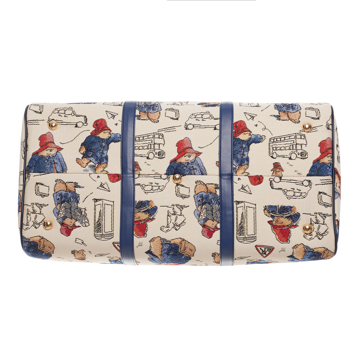 Bottom view of the cream Paddington Bear print travel bag with navy reinforcement straps and protective metal feet.